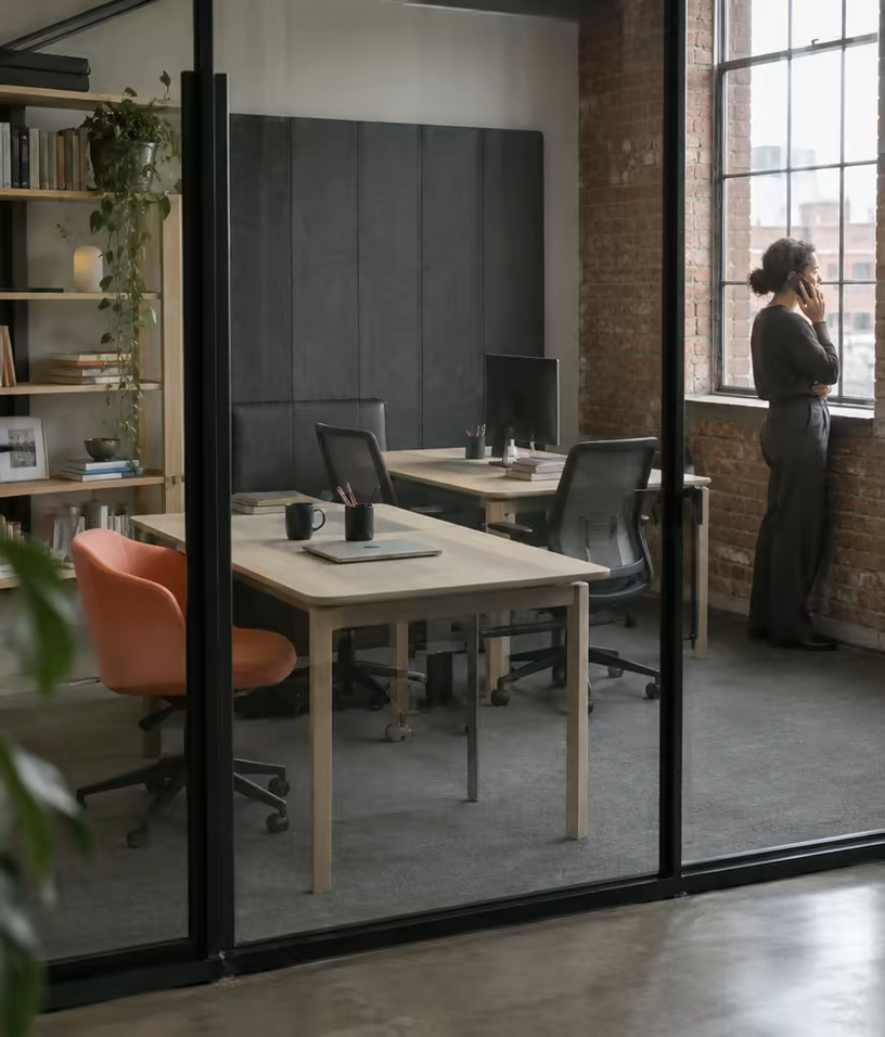 A private office on the first floor at Loft Nine, seen through its glass partition.