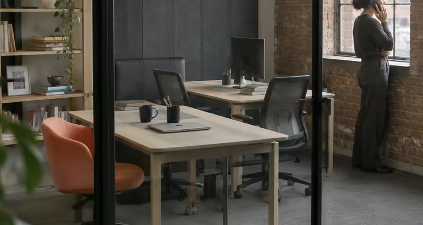 A private office behind a glass partition at Loft Nine.
